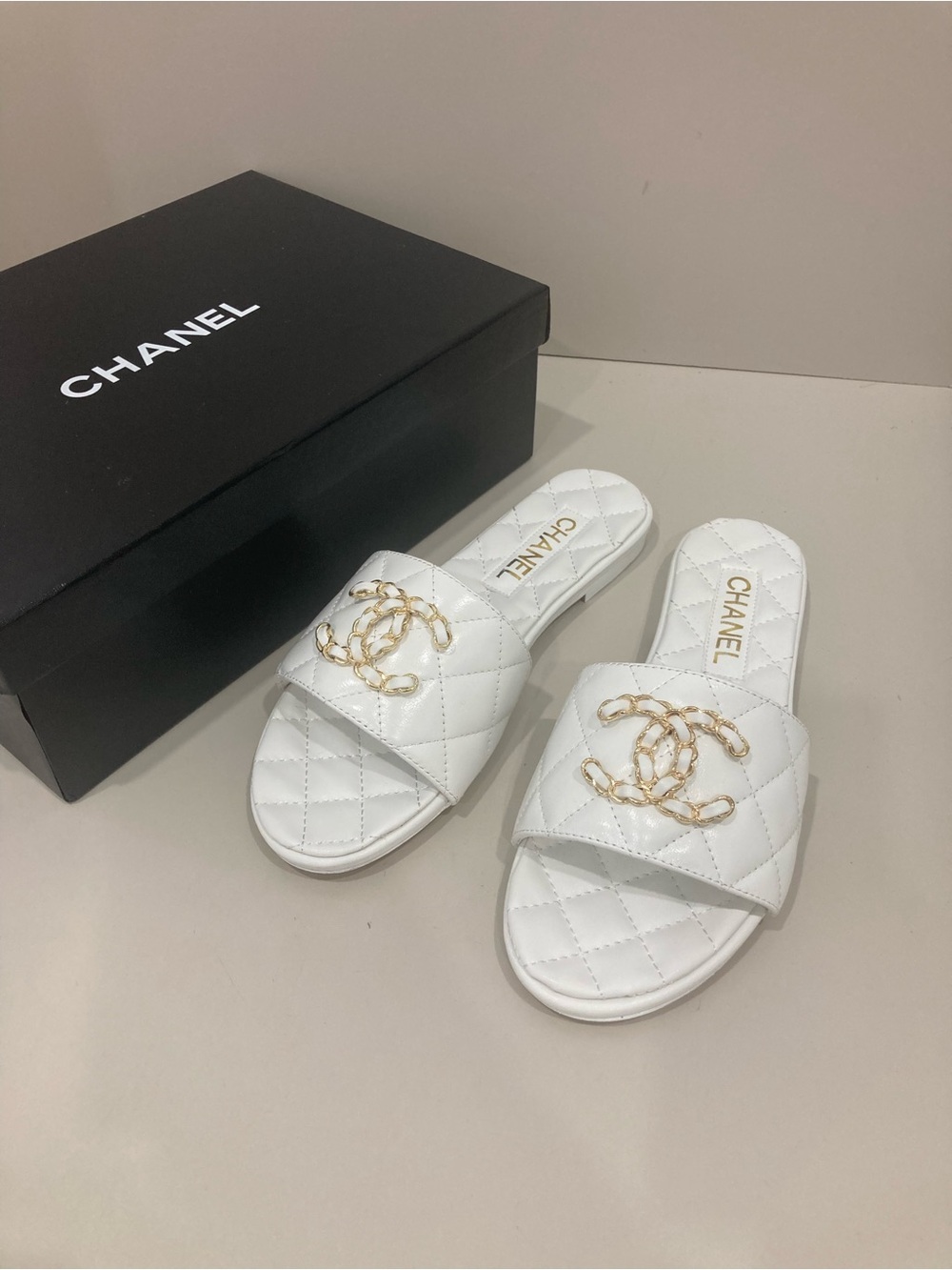 CHANEL White Quilted Slide Mules with Gold CC Chain Logo